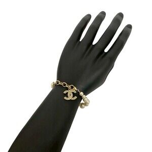 CHANEL Gold Pearl Logo Charm Bracelet